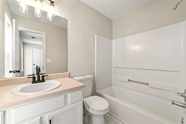 bathroom with visible vents, toilet, bathtub / shower combination, a textured ceiling, and vanity