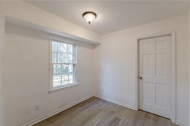 empty room with light wood-type flooring