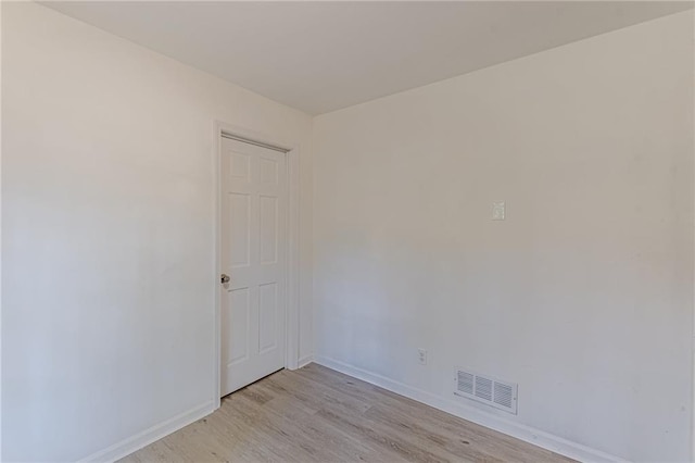 unfurnished room with light hardwood / wood-style floors