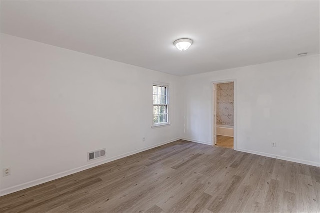 unfurnished room featuring light hardwood / wood-style flooring