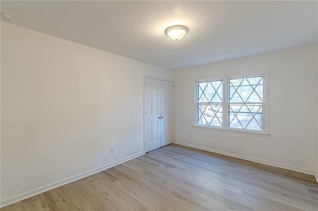 spare room featuring light hardwood / wood-style flooring