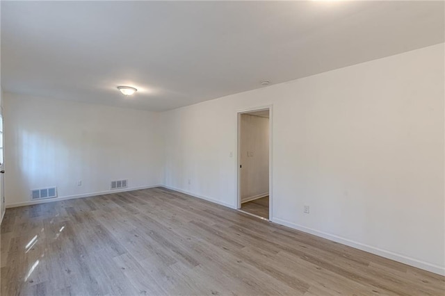 spare room featuring light hardwood / wood-style flooring