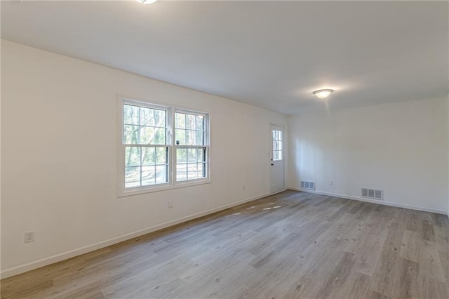 empty room with light wood-type flooring