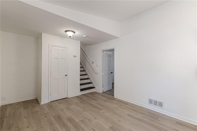 basement featuring light hardwood / wood-style floors