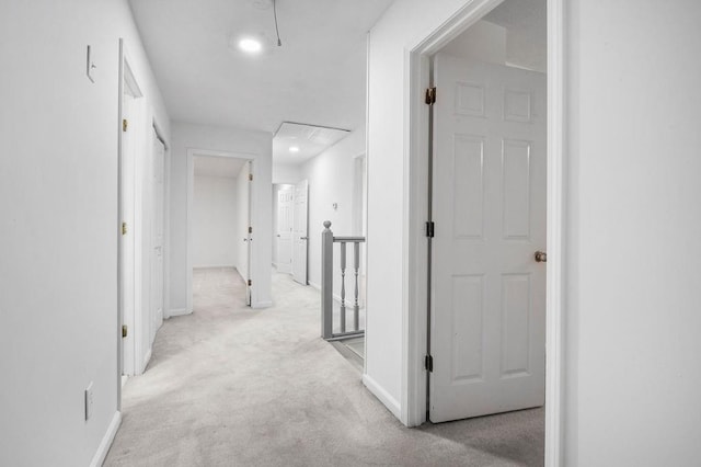 corridor with light colored carpet