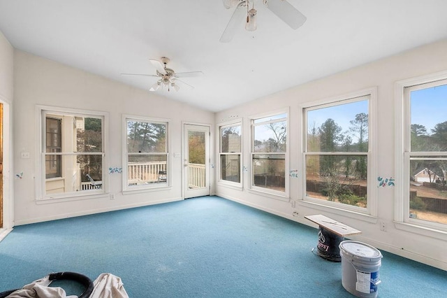 unfurnished sunroom with lofted ceiling, plenty of natural light, and ceiling fan