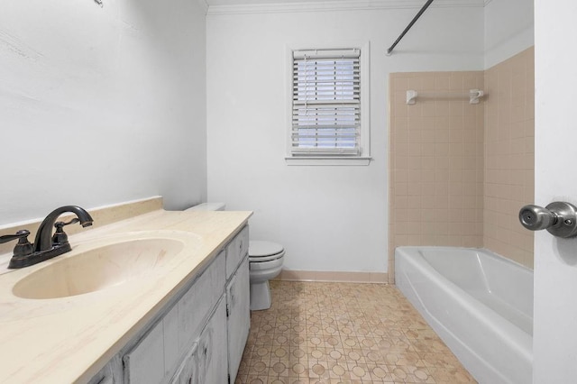 full bathroom with tiled shower / bath, vanity, and toilet