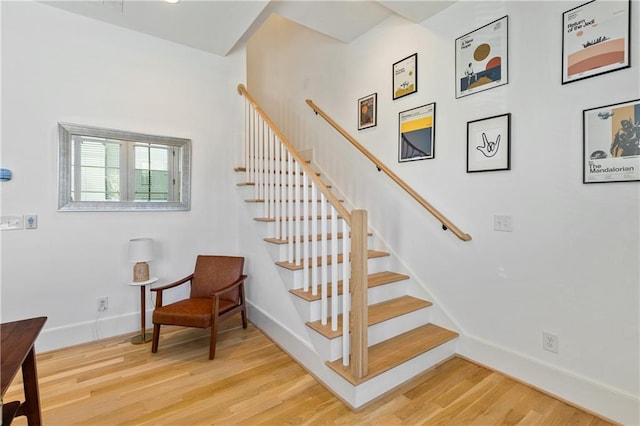 stairs with hardwood / wood-style floors