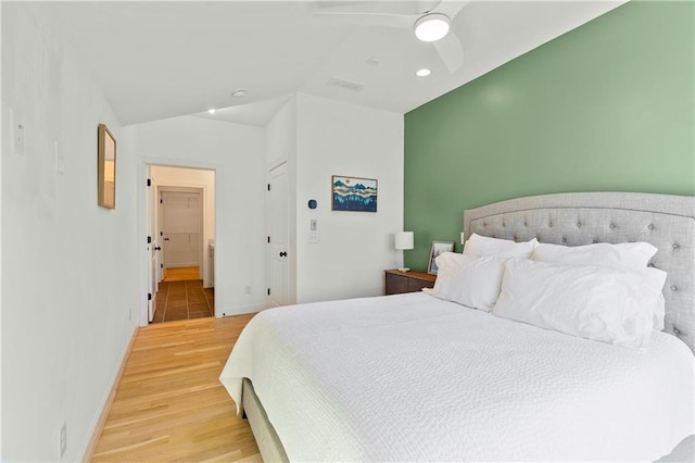 bedroom with ceiling fan, a closet, and hardwood / wood-style floors