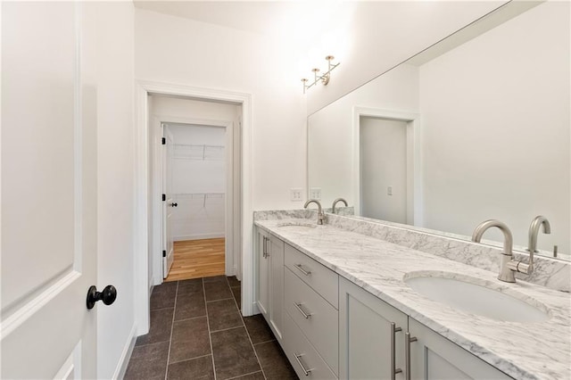 bathroom featuring tile patterned floors and vanity