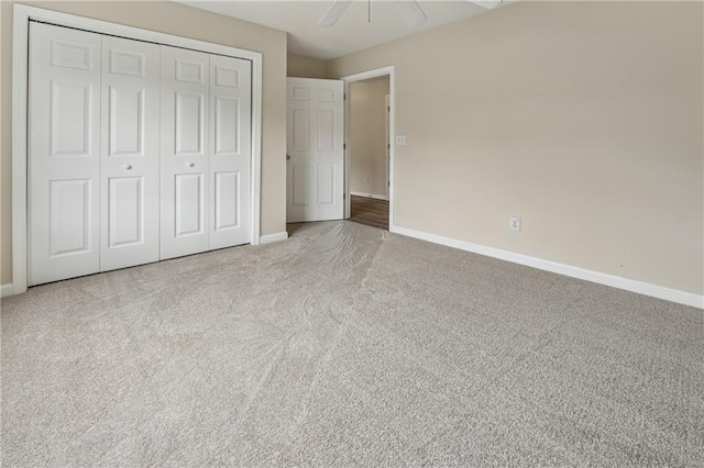 4958 Alpine Ct, Winston, GA 30187 - unfurnished bedroom with baseboards, carpet, a closet, and ceiling fan