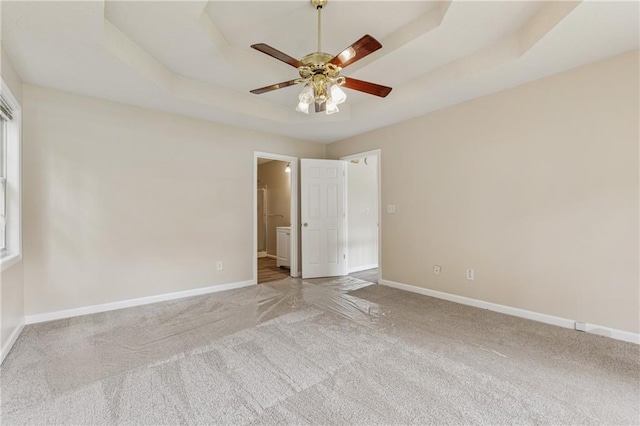 4958 Alpine Ct, Winston, GA 30187 - unfurnished bedroom with carpet flooring, baseboards, a raised ceiling, ensuite bath, and a ceiling fan