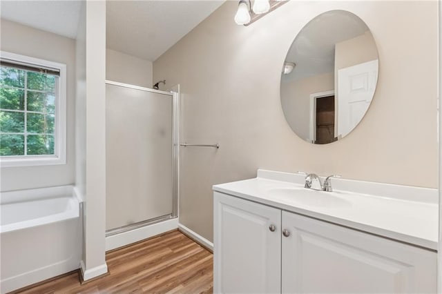 4958 Alpine Ct, Winston, GA 30187 - bathroom featuring a shower stall, vanity, a bath, and wood finished floors