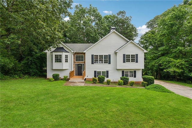4958 Alpine Ct, Winston, GA 30187 - raised ranch with a front lawn, a chimney, and view of scattered trees