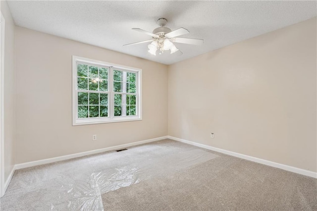 4958 Alpine Ct, Winston, GA 30187 - unfurnished room featuring carpet floors, ceiling fan, baseboards, and a textured ceiling