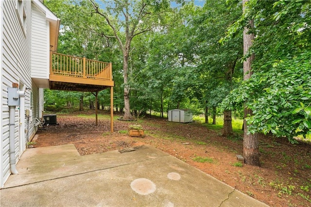 4958 Alpine Ct, Winston, GA 30187 - view of yard featuring a patio area, a wooden deck, view of wooded area, and cooling unit