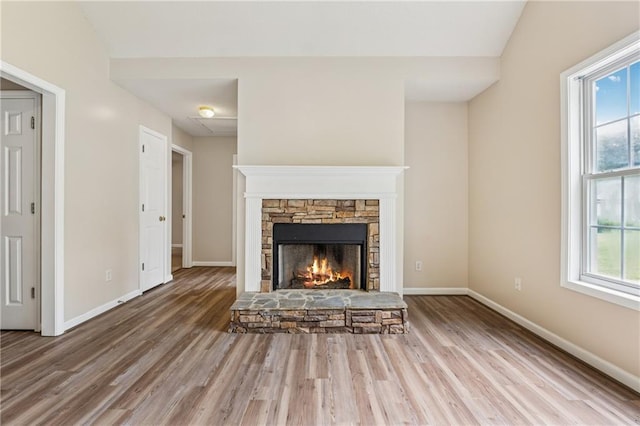 4958 Alpine Ct, Winston, GA 30187 - unfurnished living room with wood finished floors, healthy amount of natural light, baseboards, and lofted ceiling