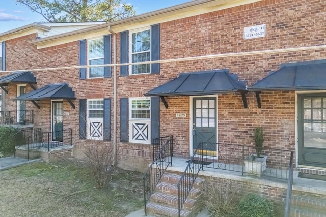 view of front of home with brick siding