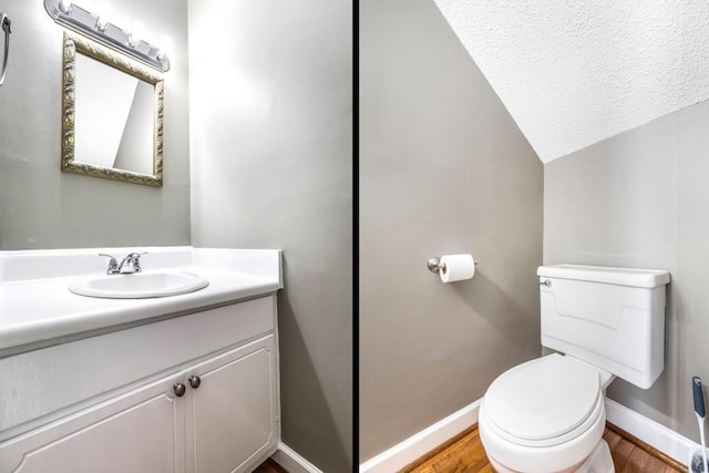 bathroom featuring toilet, baseboards, and wood finished floors