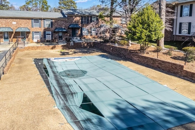 view of pool with fence