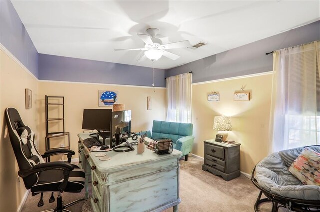 carpeted bedroom featuring baseboards, ceiling fan, and visible vents