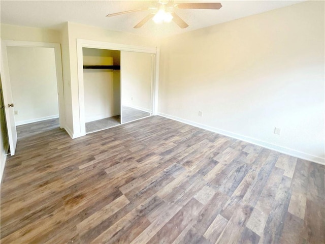 unfurnished bedroom featuring hardwood / wood-style flooring, ceiling fan, and a closet