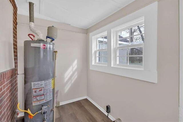 utility room featuring gas water heater