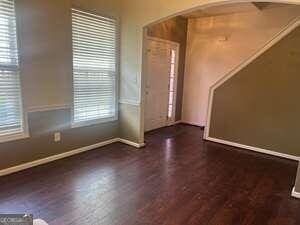 interior space with dark wood-type flooring