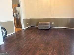 empty room with dark wood-type flooring