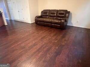 living room with dark hardwood / wood-style flooring