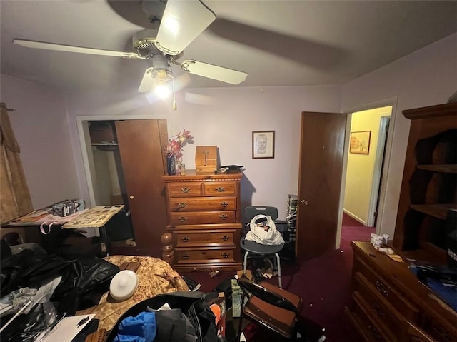 bedroom with ceiling fan and a closet