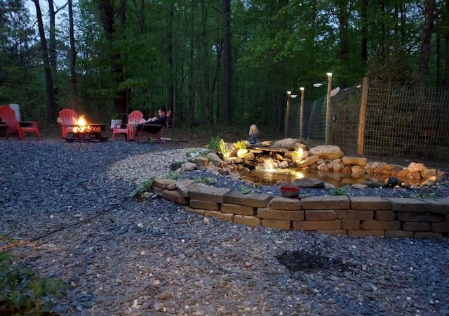 view of yard with an outdoor fire pit