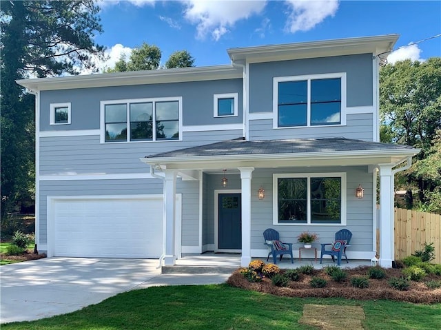 view of front facade featuring a garage and covered porch