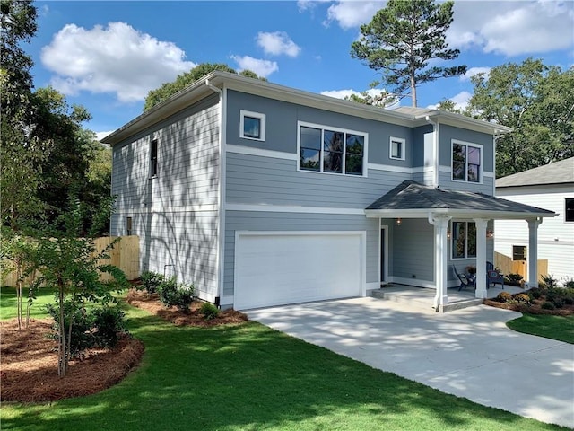 view of front facade with a garage, covered porch, and a front yard