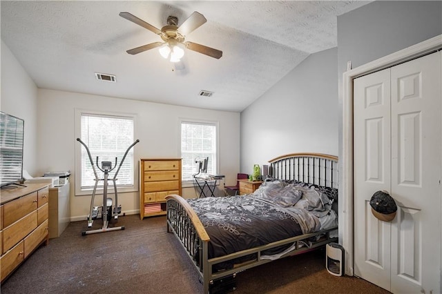 bedroom with baseboards, visible vents, a ceiling fan, vaulted ceiling, and a textured ceiling