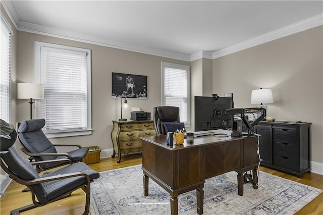 home office with baseboards, wood finished floors, and ornamental molding