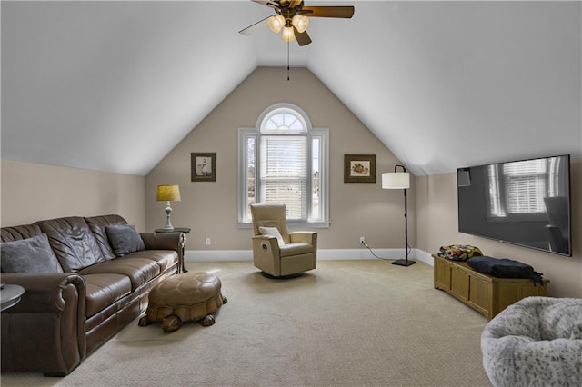 living room with baseboards, light carpet, lofted ceiling, and ceiling fan