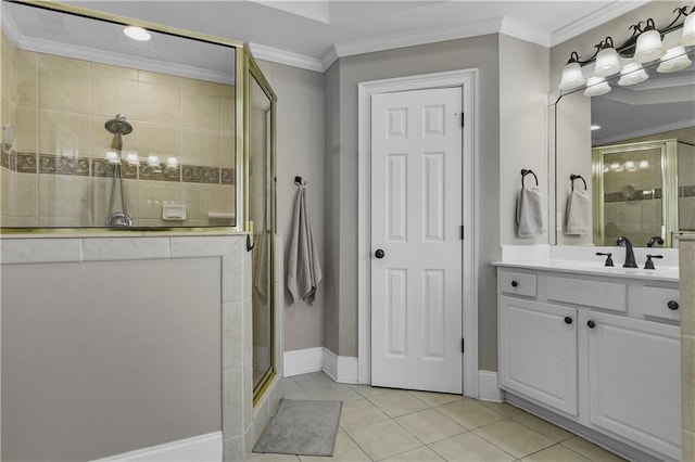 full bath featuring vanity, baseboards, a stall shower, tile patterned flooring, and crown molding