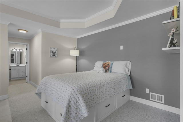 bedroom featuring visible vents, a raised ceiling, crown molding, and baseboards