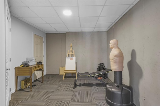 workout room with carpet and a drop ceiling