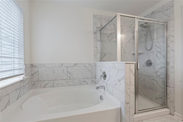 2231 Bedell Dr, Conyers, GA 30094 - bathroom featuring a bath, a stall shower, and marble look tile flooring