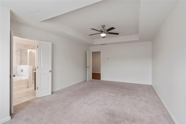 2231 Bedell Dr, Conyers, GA 30094 - empty room with carpet floors, a ceiling fan, and a tray ceiling