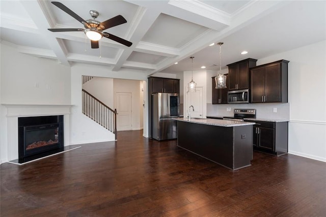 2231 Bedell Dr, Conyers, GA 30094 - kitchen featuring stainless steel appliances, beam ceiling, dark brown cabinetry, ceiling fan, and dark wood-style floors