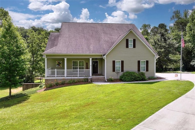 806 Skelton Rd, Hoschton, GA 30548 - view of front facade with a porch, a front lawn, and roof with shingles