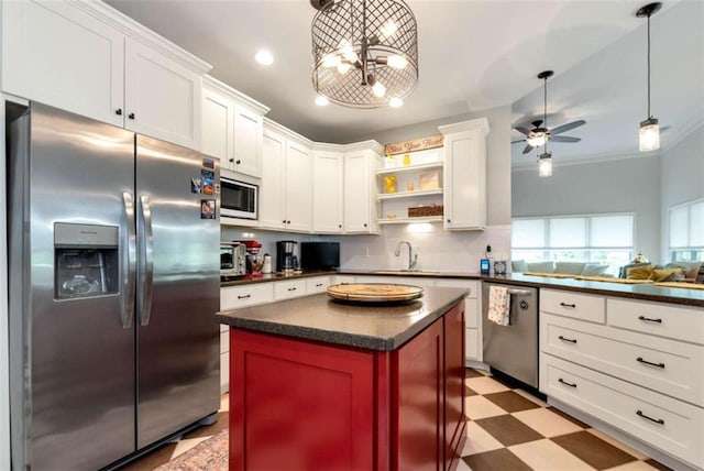 806 Skelton Rd, Hoschton, GA 30548 - kitchen with stainless steel appliances, dark countertops, light flooring, open shelves, and white cabinetry