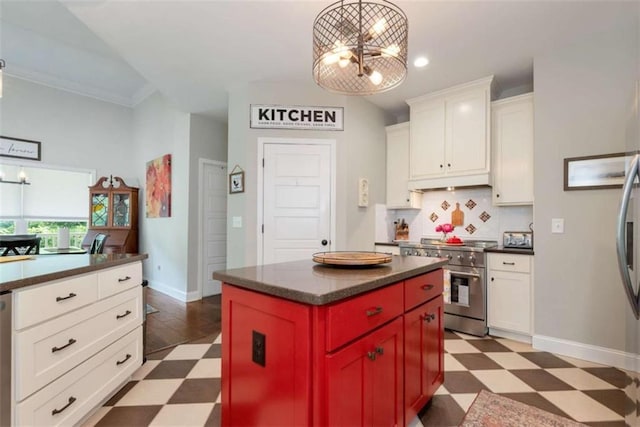 806 Skelton Rd, Hoschton, GA 30548 - kitchen with high end stainless steel range, tile patterned floors, dark countertops, backsplash, and white cabinetry