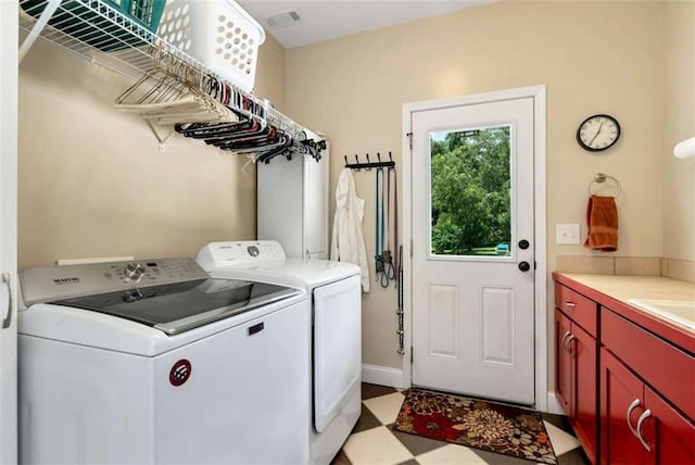 806 Skelton Rd, Hoschton, GA 30548 - laundry room featuring washer and clothes dryer, cabinet space, and light floors