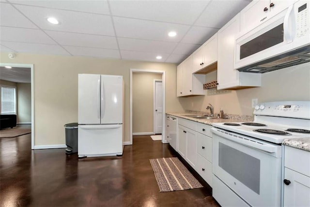 806 Skelton Rd, Hoschton, GA 30548 - kitchen featuring white appliances, concrete floors, white cabinets, a drop ceiling, and recessed lighting