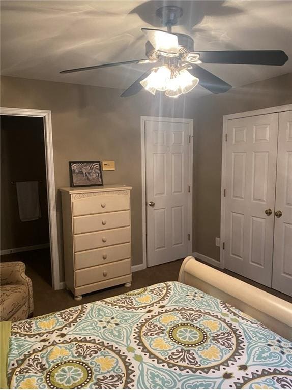 180 Hightower Lake Trl, Ball Ground, GA 30107 - bedroom featuring a closet, a ceiling fan, and dark carpet