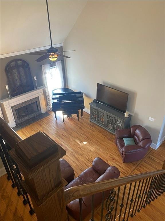 180 Hightower Lake Trl, Ball Ground, GA 30107 - living area with ceiling fan, a fireplace with flush hearth, wood finished floors, and high vaulted ceiling